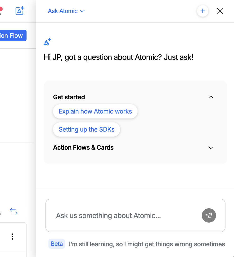 The Ask Atomic button in the top-right of the Workbench header, and the chat sidebar opened on the right showing the empty state with starter prompt categories