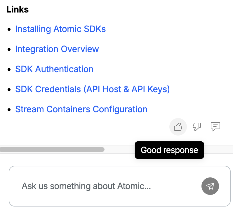 An assistant response in the Ask Atomic sidebar with the thumbs-up, thumbs-down, and feedback icons visible at the bottom-right